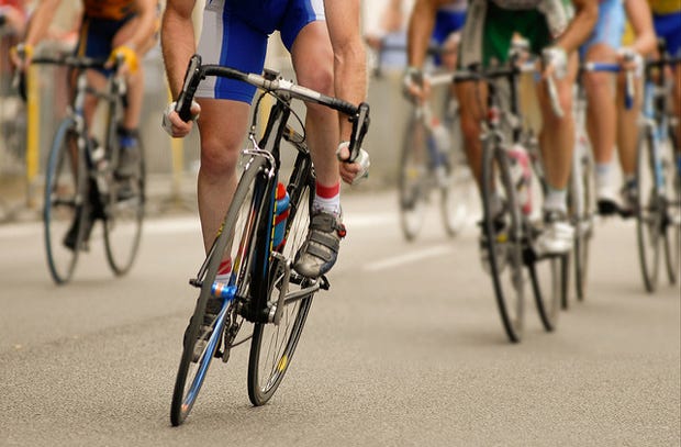 People cycling on a road