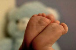 Soles of baby feet up close