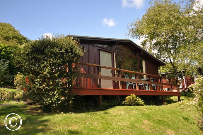 A detached cedarwood lodge is one of a group of 40 lodges, well spaced out