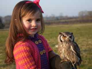 Girl holding an owl