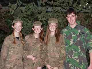 Group of children wearing camouflage gear